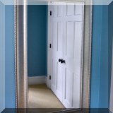 DM05. Wall mirror with silver-colored frame. 57”h x 33”w 